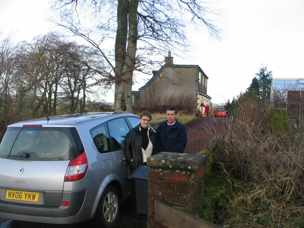 Judy Shiels & David French at the gate to East Mains in Scotland