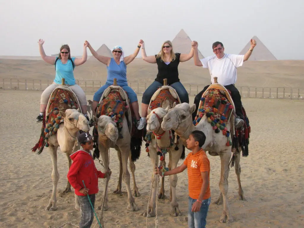 Egypt, 2011 — Dan, Judy, Tracy and Jenn at the Pyramids of Giza with Camels